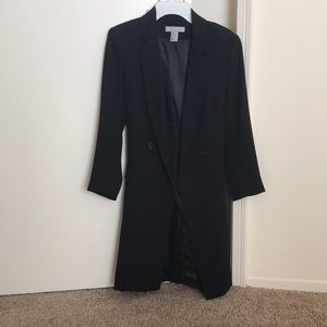 Knee-length black coat by H&M.